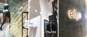 Light-coloured timbers and smooth black metal set off the white Dura Tumbled quick brick from DuraBric – Edge Clothing fit out, Melbourne