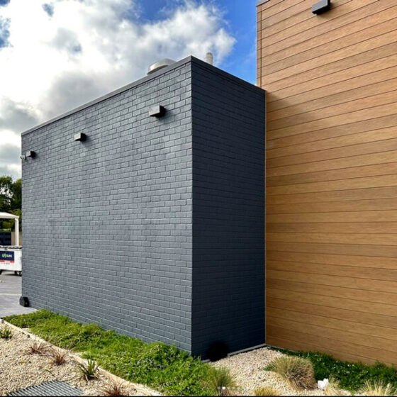 Dura Tumbled brick profile from DuraBric, applied to outside walls, sealed and painted – Taco Bell, Australia