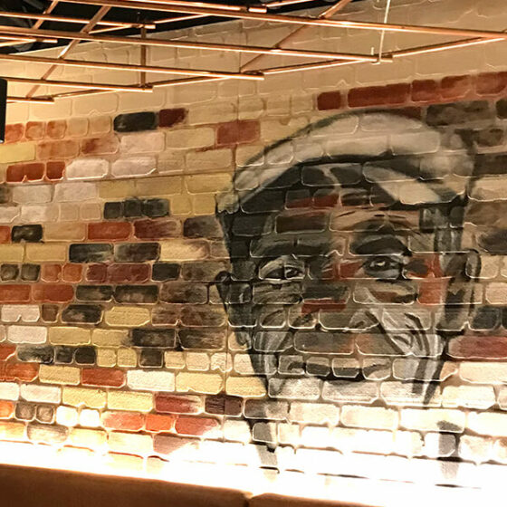 A joyous eatery displaying a traditional Dura Rustic brick profile. Finished with a painted wall art – Quay & Co, Sydney, Australia.