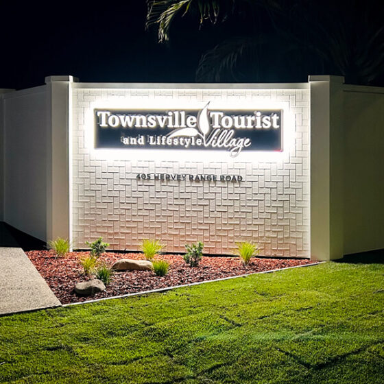Dura Herringbone 3 brick profile from DuraBric – painted external fence with branded neon signage – Townsville Tourist, Queensland.
