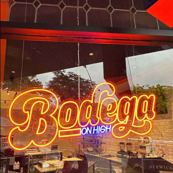 Dura Rustic brick provides contrasting interior wall for Bodega on High neon signage at new Berwick eatery in Melbourne.